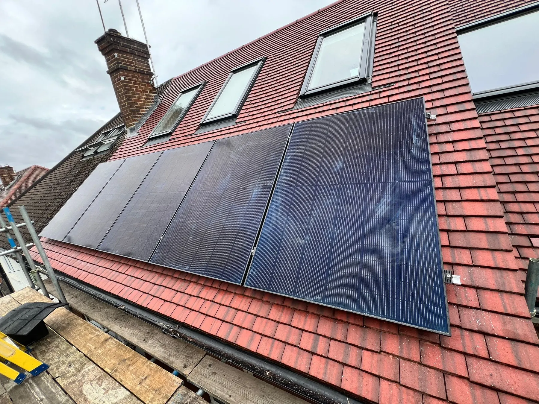 Solar panel installation on a roof in Mill Hill, London